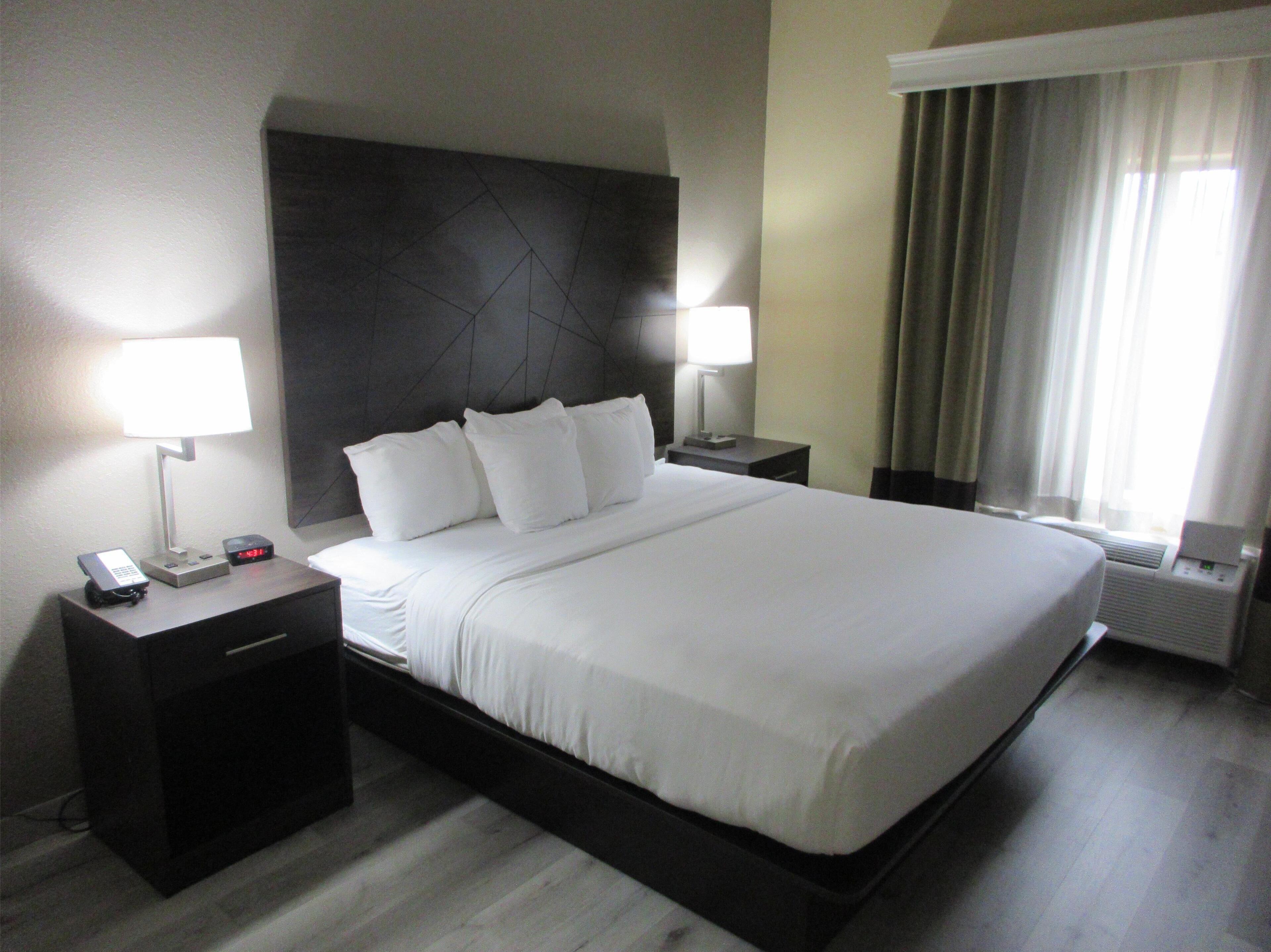 Desk, blackout drapes, iron/ironing board, free rollaway beds