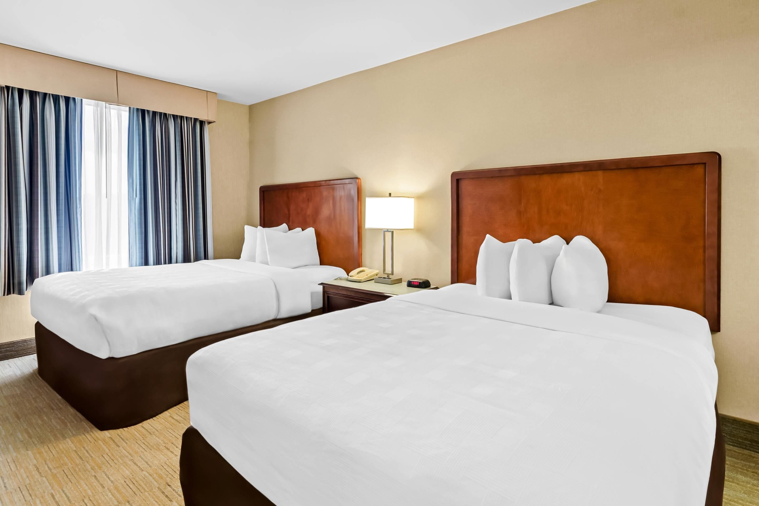 2 queen beds, efficiency, suite, nonsmoking | premium bedding, in-room safe, desk, laptop workspace