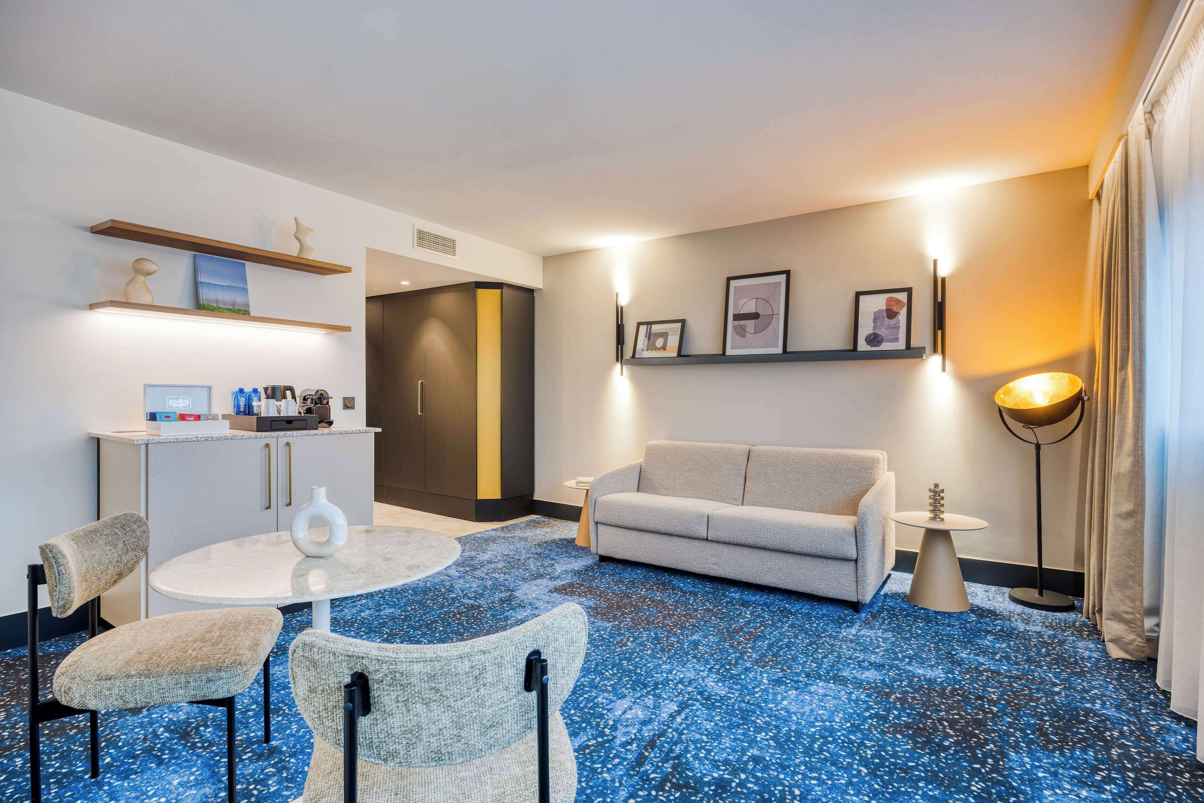 junior suite, 1 king bed | living area | lcd tv, pay films