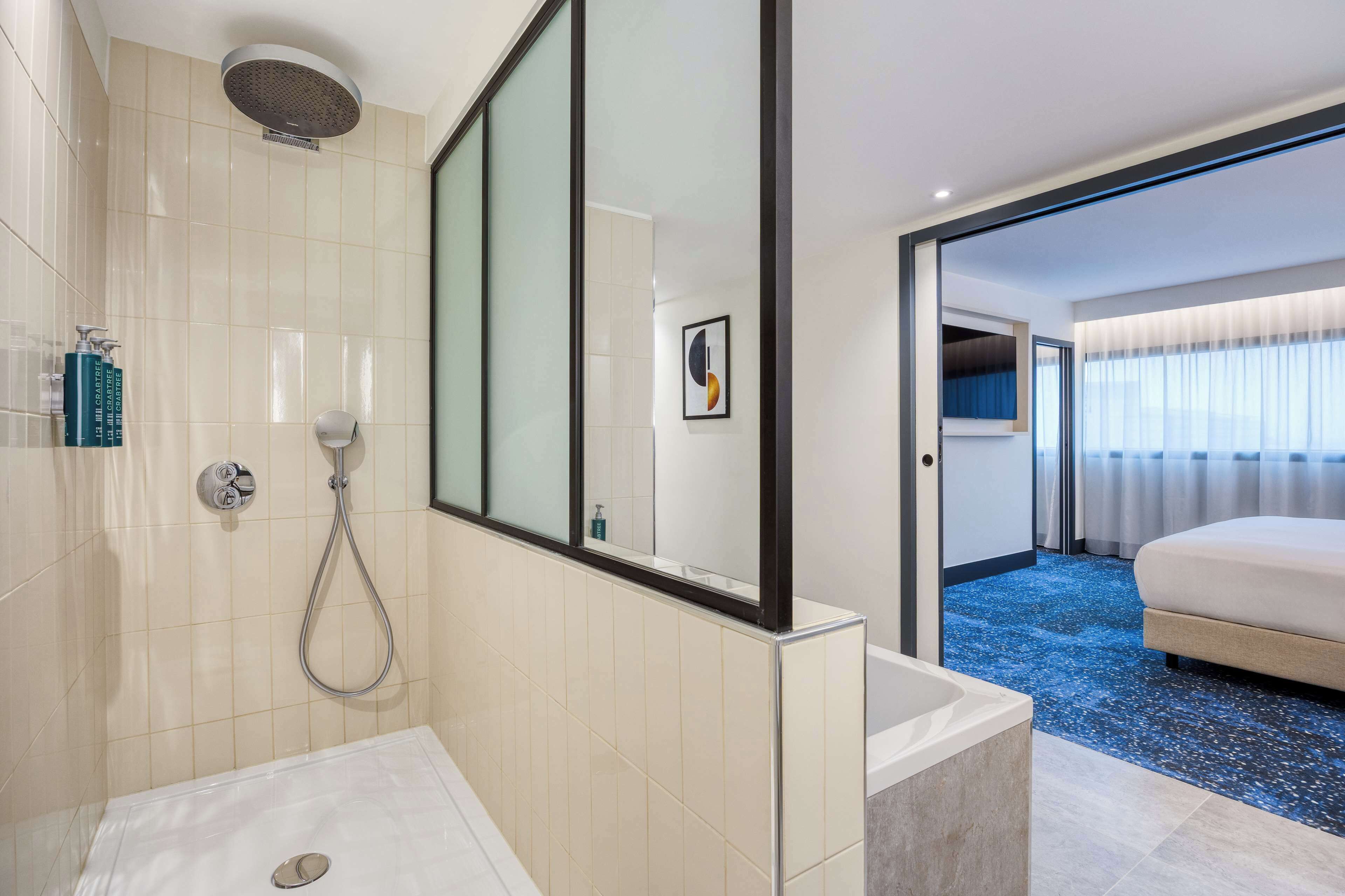 junior suite, 1 king bed | bathroom shower