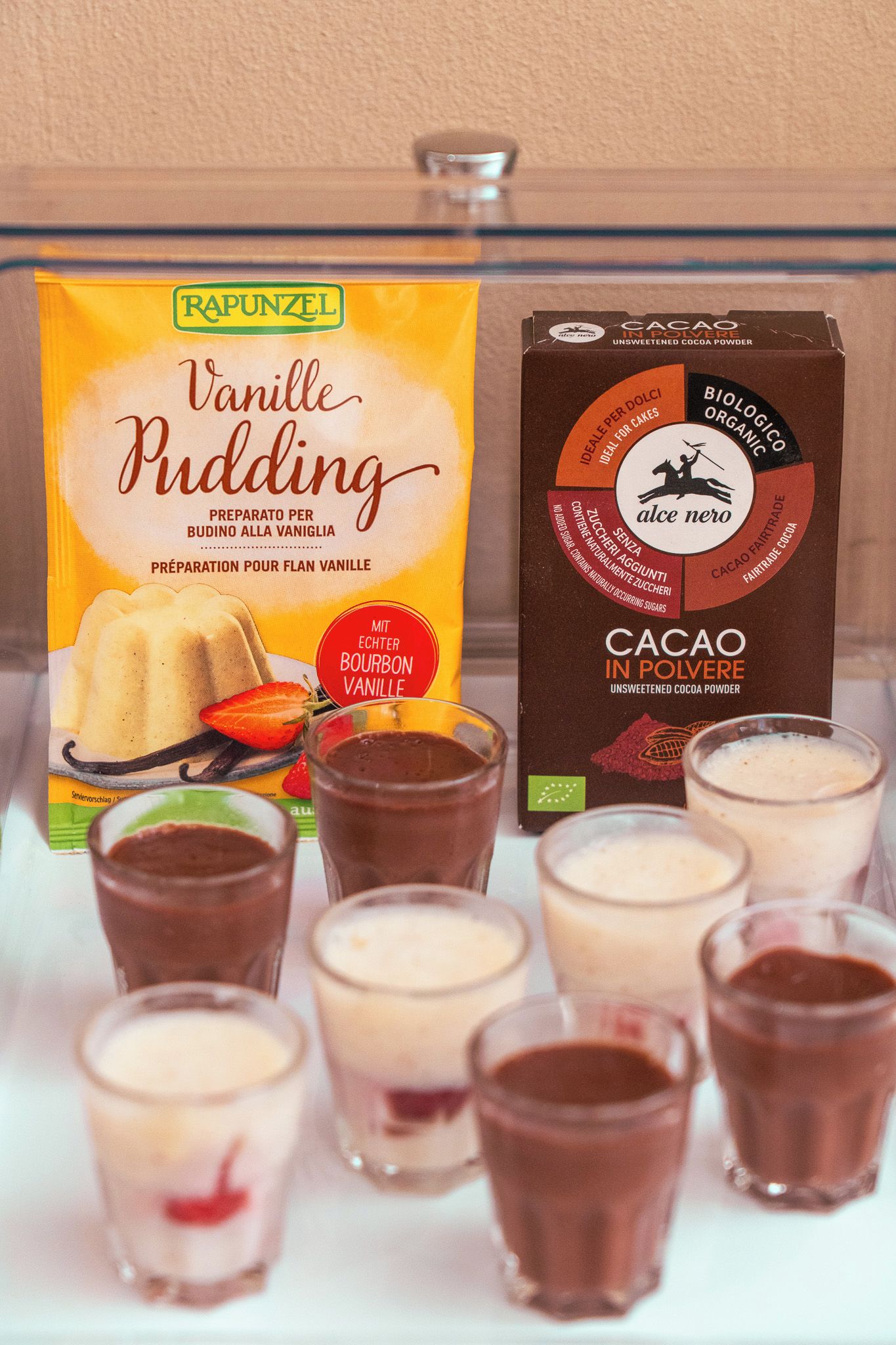 A box of Rapunzel Vanilla Pudding and a box of Cacao in Polvere.