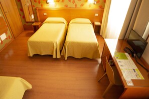 Standard Quadruple Room | 1 bedroom, down comforters, minibar, in-room safe