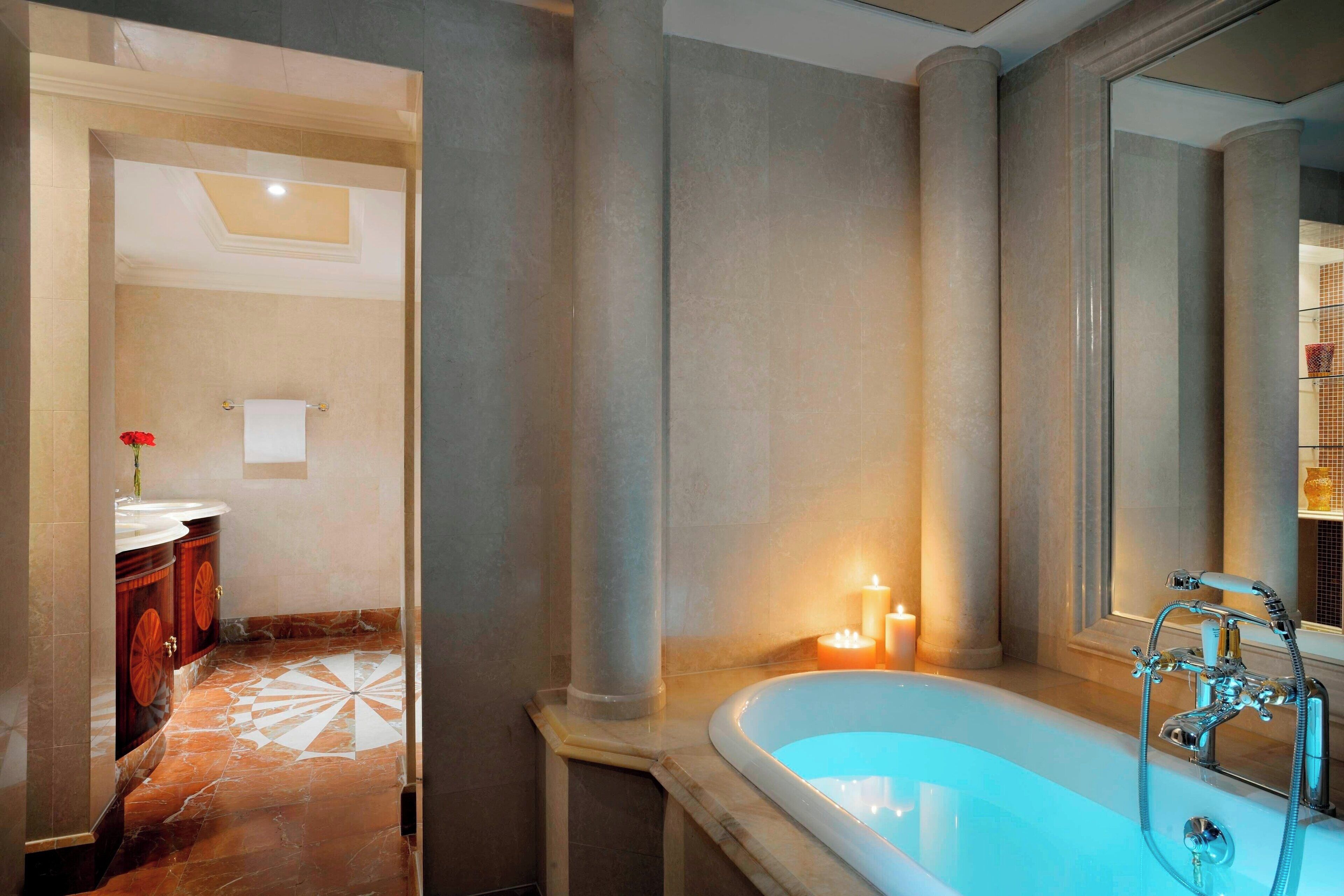 executive suite, 2 bedrooms | bathroom | separate bathtub and shower, deep-soaking bathtub, designer toiletries