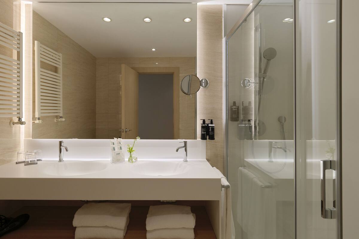 eco-friendly toiletries, hair dryer, bidet, towels