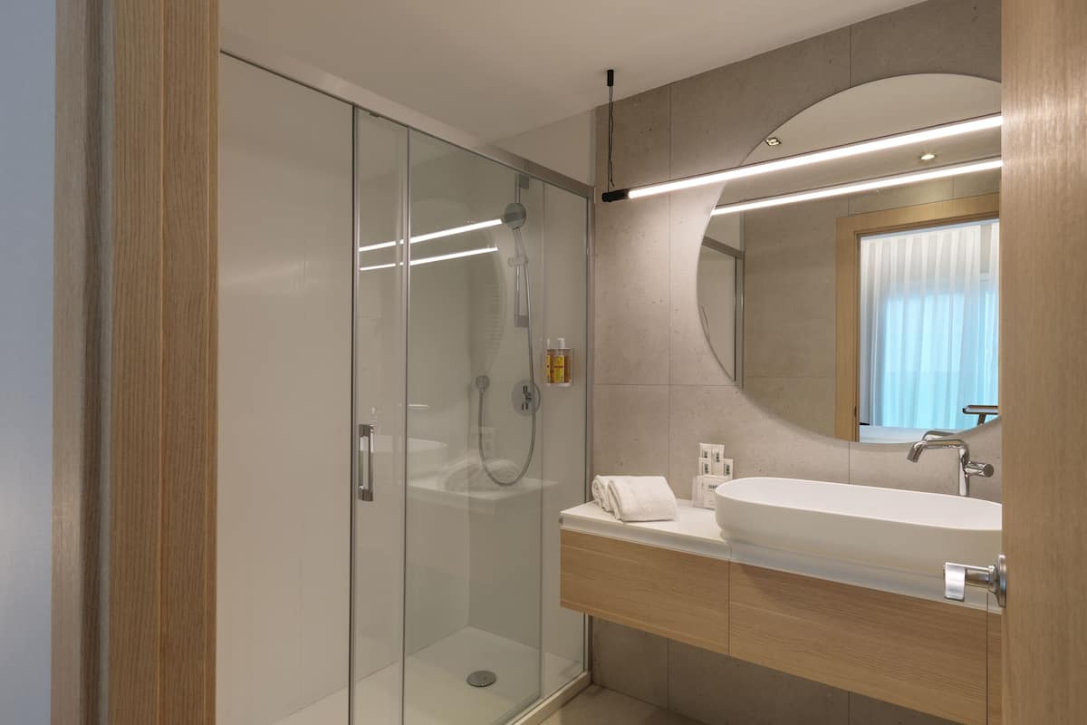 eco-friendly toiletries, hair dryer, bidet, towels