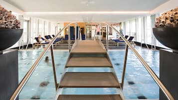 Indoor pool, open 7:00 AM to 10:00 PM, pool loungers