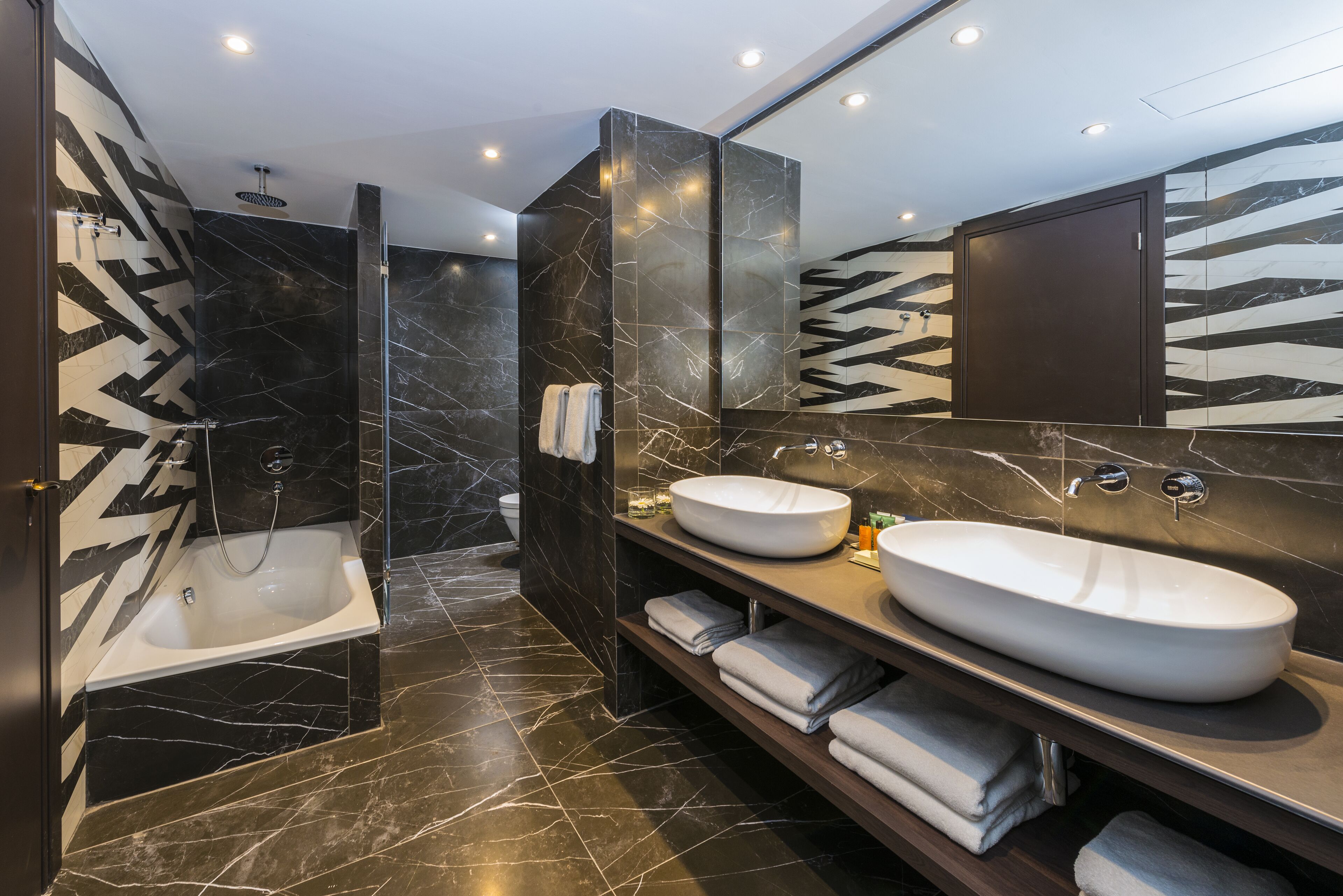 designer toiletries, hair dryer, bathrobes, slippers