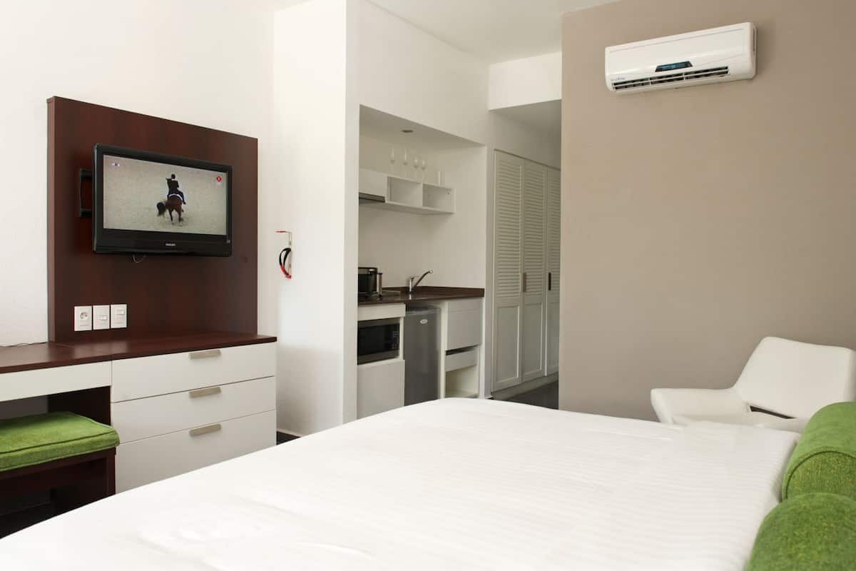 superior room, kitchenette (room opens to garden) | in-room safe, iron/ironing board, cots/infant beds, free wifi