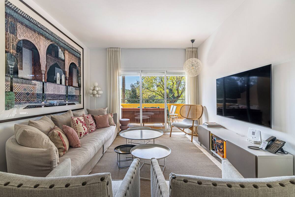 Deluxe Apartment | Living area | 32-inch LED TV with satellite channels