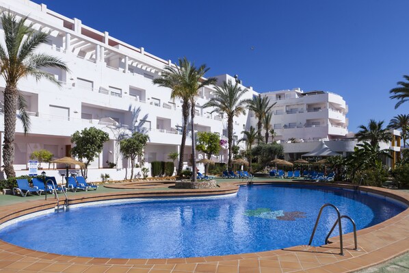Seasonal outdoor pool, pool umbrellas, pool loungers