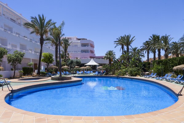 Seasonal outdoor pool, pool umbrellas, pool loungers