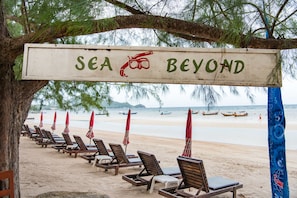 Private beach, white sand, sun loungers, beach umbrellas