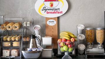 A breakfast station with a sign indicating 'Superstart breakfast' and operating hours from 6:30 to 9:30 AM.