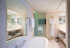 Separate tub and shower, hair dryer, bathrobes, slippers