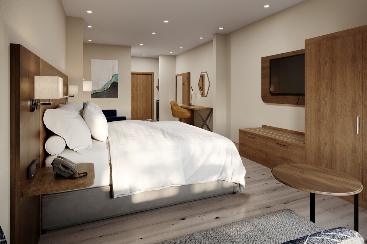 Premium bedding, desk, laptop workspace, blackout curtains