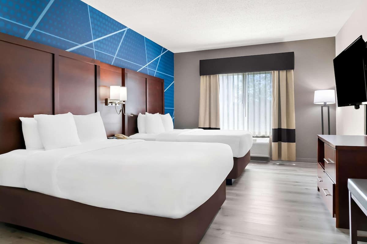 Premium bedding, desk, laptop workspace, blackout curtains