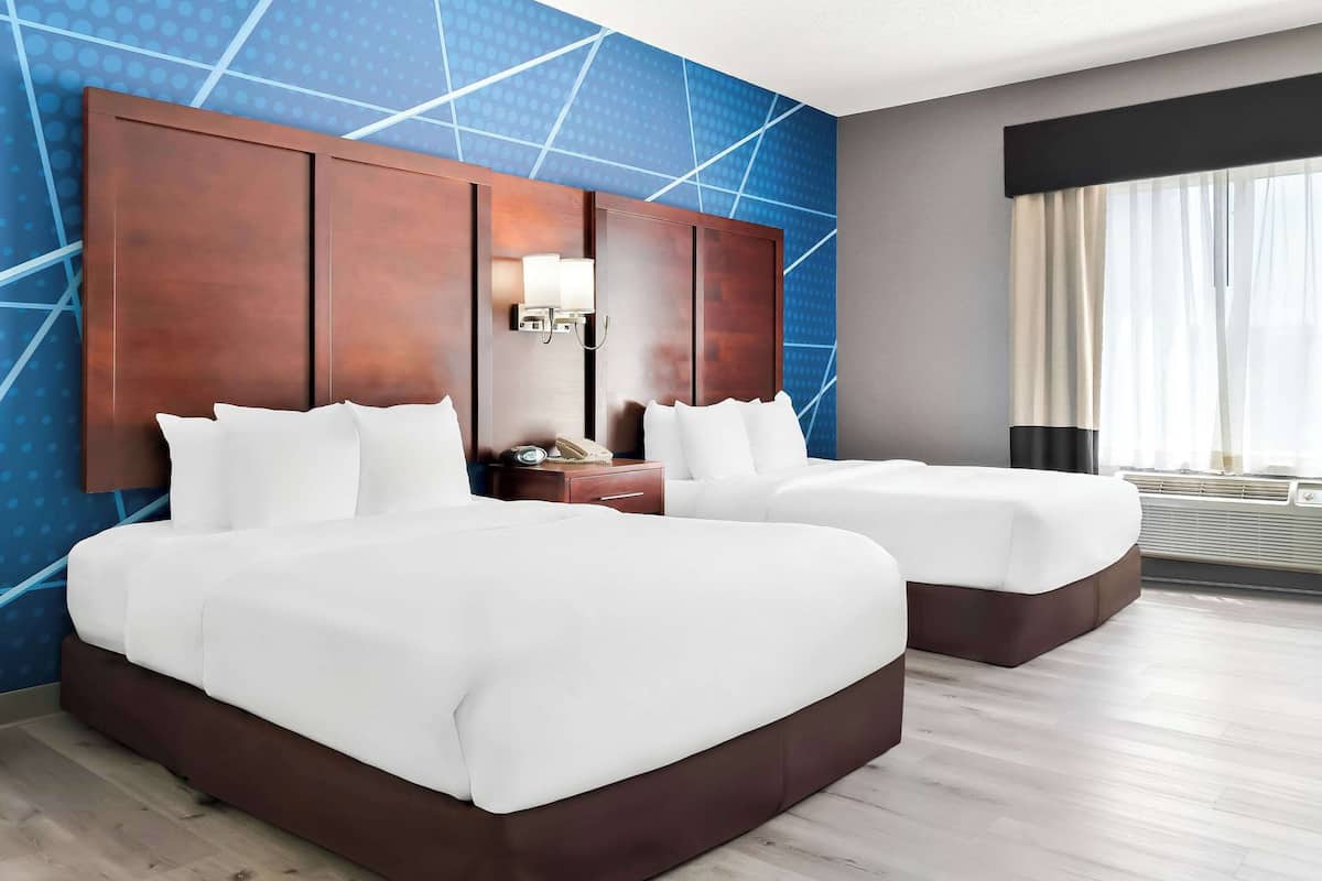 Premium bedding, desk, laptop workspace, blackout curtains