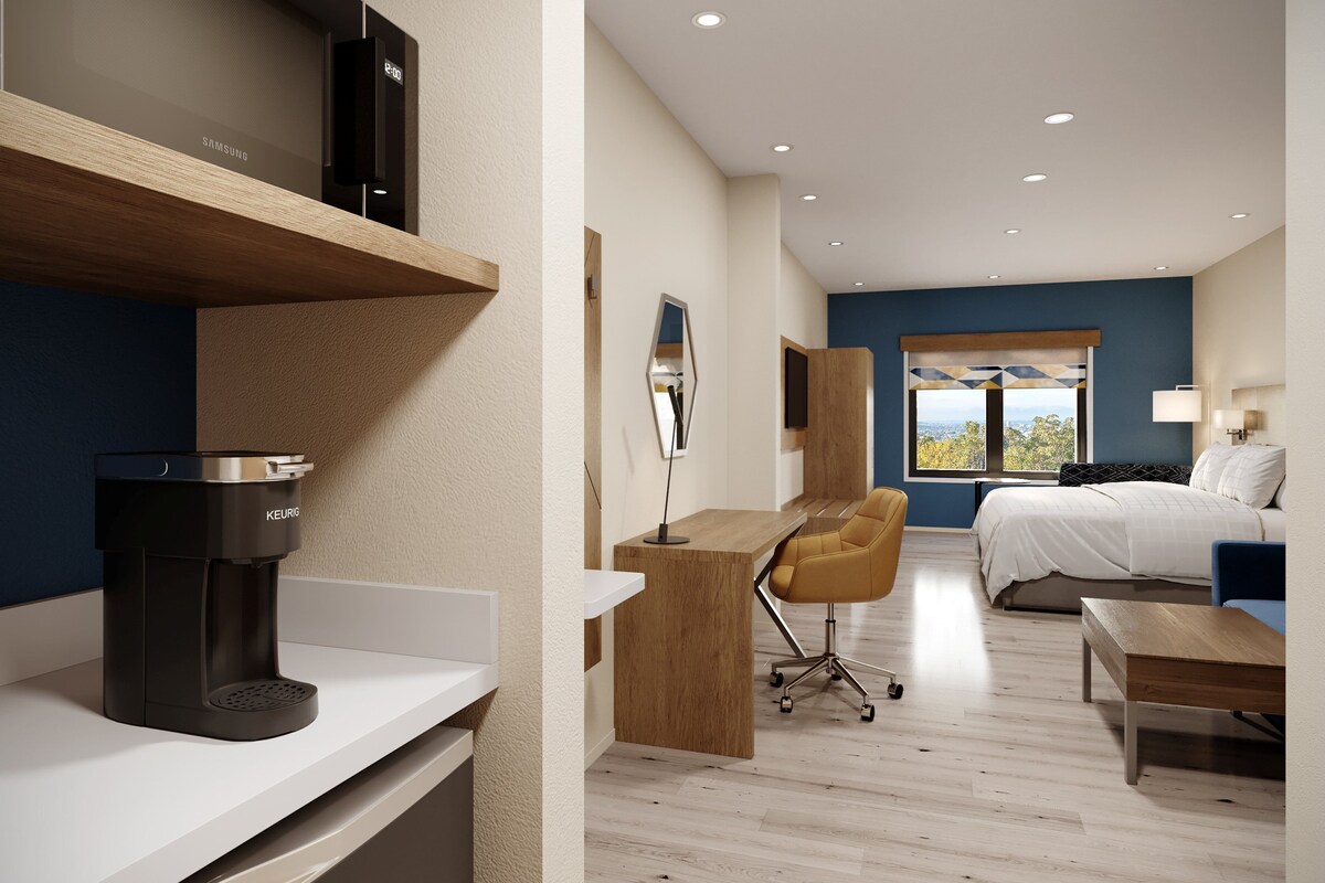 Premium bedding, desk, laptop workspace, blackout curtains
