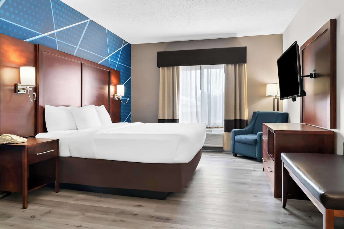 Premium bedding, desk, laptop workspace, blackout curtains