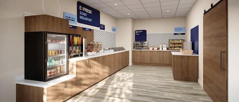 A modern breakfast area with a refrigerated display, a fruit and cereal section, and a bread display.