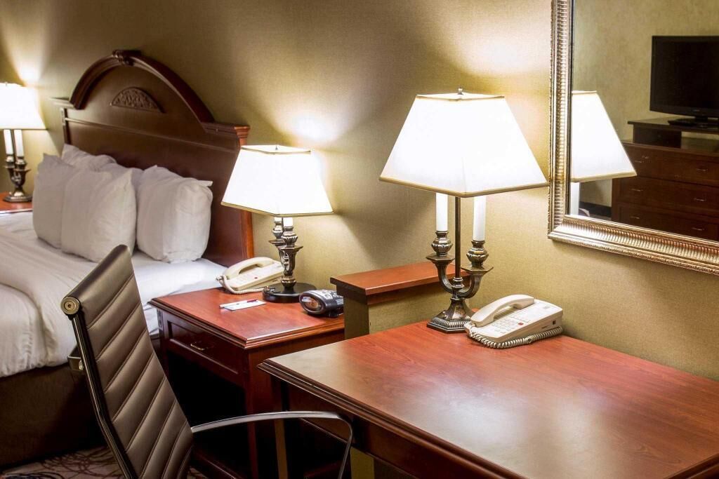 Premium bedding, desk, laptop workspace, blackout curtains