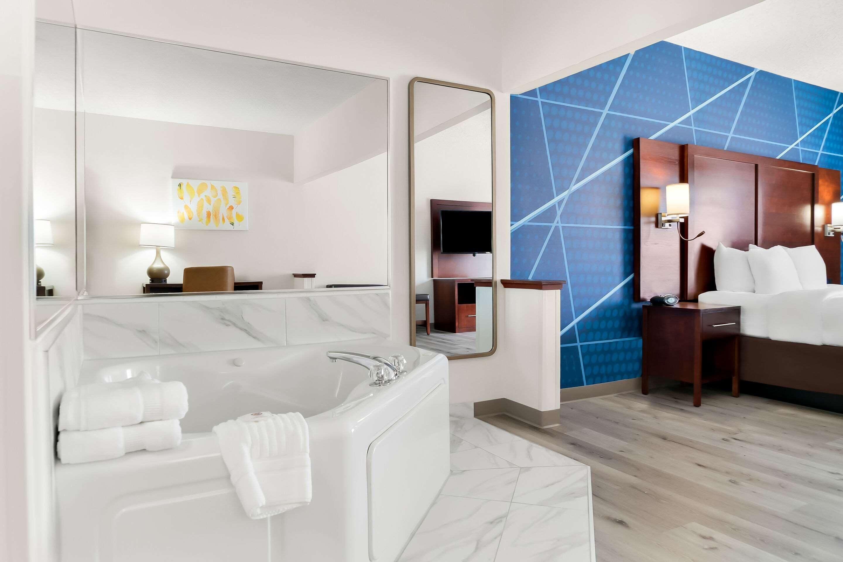 Premium bedding, desk, laptop workspace, blackout curtains