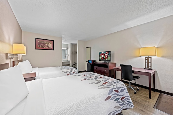 Desk, blackout drapes, cribs (free), WiFi (free)