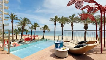 On the beach, sun-loungers, beach umbrellas, beach towels