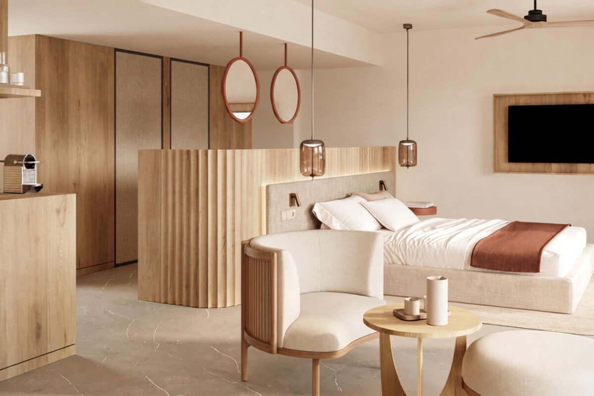 A modern bedroom with a bed, a desk, and a chair.