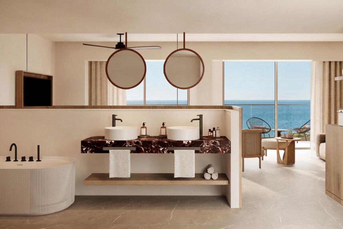 A modern bathroom with two sinks, a large mirror, and a ceiling fan.