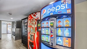 Vending machines with Pepsi and other beverages, a refrigerator, and a microwave. - Motel 6 Amarillo, TX - Airport (Amarillo)