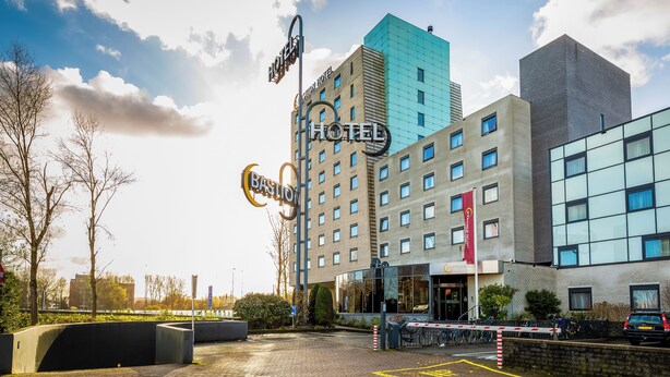 A hotel with a modern design, featuring a prominent sign and a clear view of the entrance. - Bastion Hotel Amsterdam Amstel (Amsterdam-Duivendrecht)