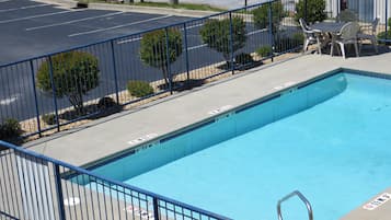 Seasonal outdoor pool, open 10 AM to 10 PM, pool umbrellas