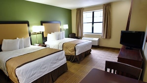 A hotel room with two beds, a desk, a chair, a television, and a window with curtains. - Extended Stay America Suites Seattle Northgate (Seattle)