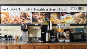 A breakfast bar with a coffee machine, toaster, and microwave. - Stay Wise Inn Cedaredge (Cedaredge)