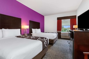 Premium bedding, pillow-top beds, desk, laptop workspace