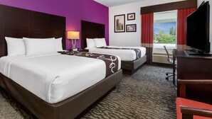 A hotel room with two beds, a desk, a TV, and a window with curtains. - La Quinta Inn & Suites by Wyndham Tampa Bay Area-Tampa South (Tampa)