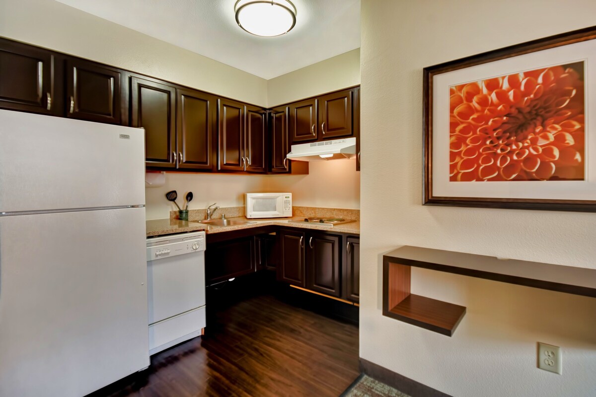 Desk, iron/ironing board, cribs (free), WiFi (free)