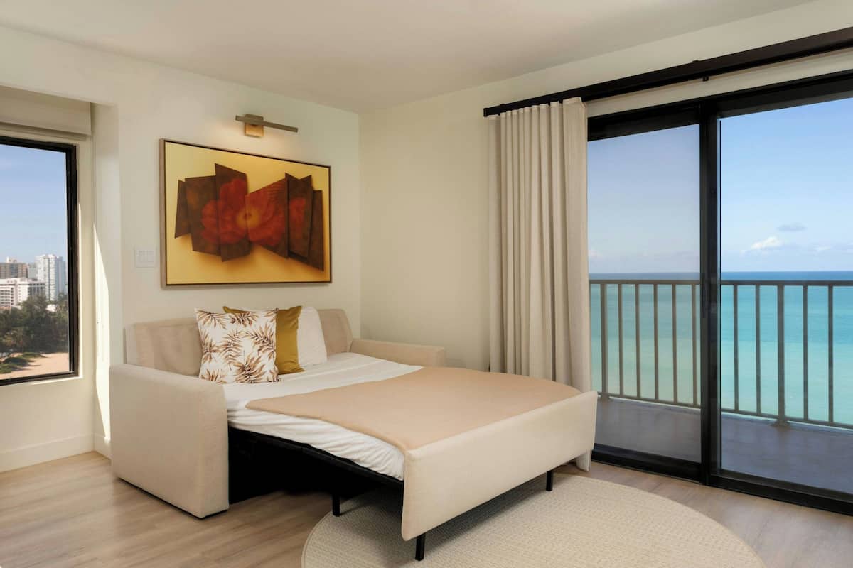 Junior Suite, 1 King Bed with Sofa bed, Beach View | In-room safe, desk, laptop workspace, blackout drapes