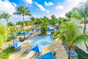 Outdoor pool, sun loungers at Courtyard by Marriott Isla Verde Beach Resort