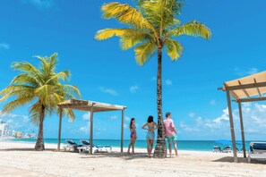 On the beach, sun-loungers, beach umbrellas, beach towels