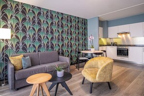 Apartment, 1 Bedroom (Street View) | Living area | Flat-screen TV