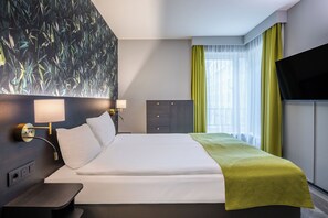 Apartment, 2 Bedrooms (Street-Court View) | In-room safe, desk, laptop workspace, iron/ironing board