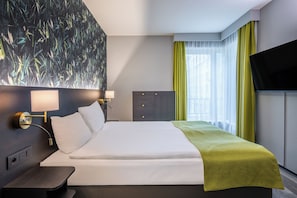Apartment, 2 Bedrooms (Street-Court View) | In-room safe, desk, laptop workspace, iron/ironing board