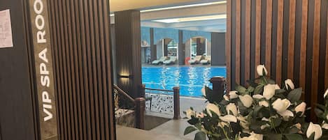 A spa room with a pool, a staircase, and a sign reading "VIP SPA ROOM".