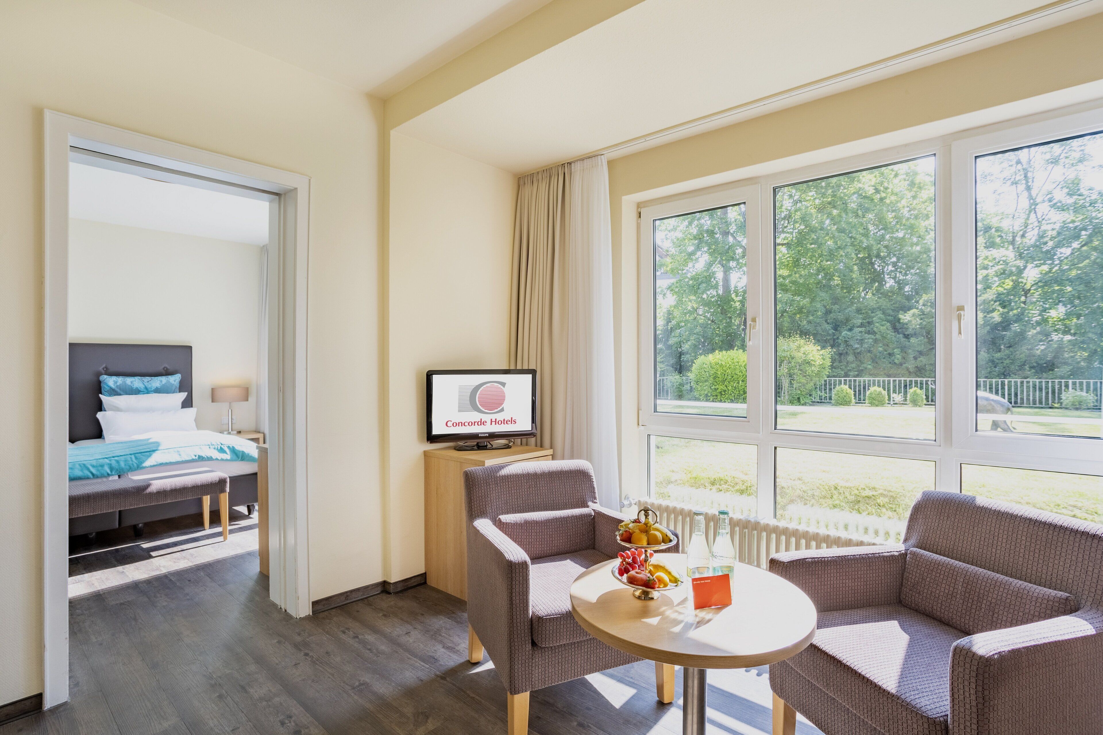 suite, garden view | 1 bedroom, in-room safe, desk, blackout curtains