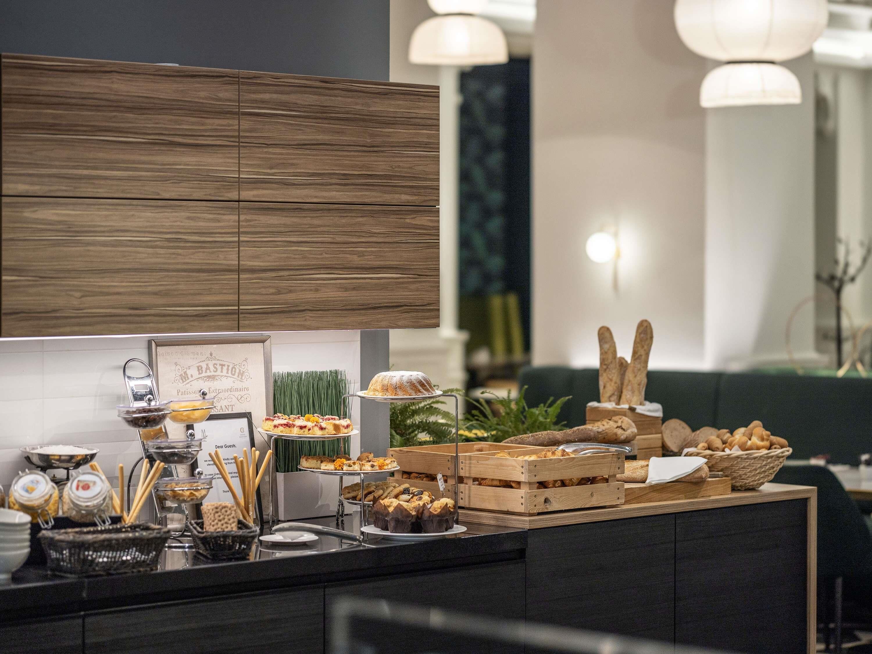 A buffet setup with various food items and a sign that reads 'M. BASSION'.