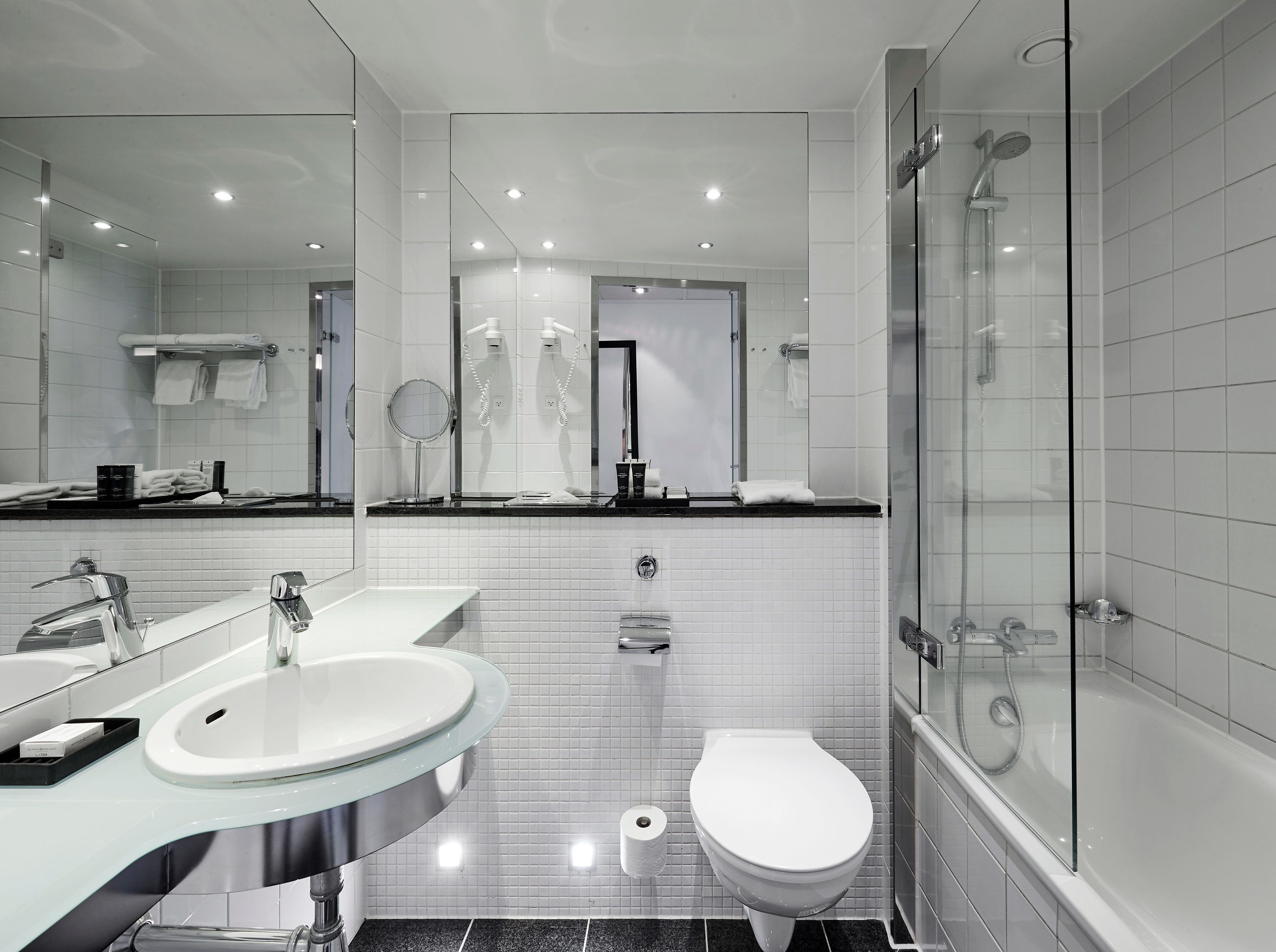 combined shower/bathtub, designer toiletries, hair dryer, towels