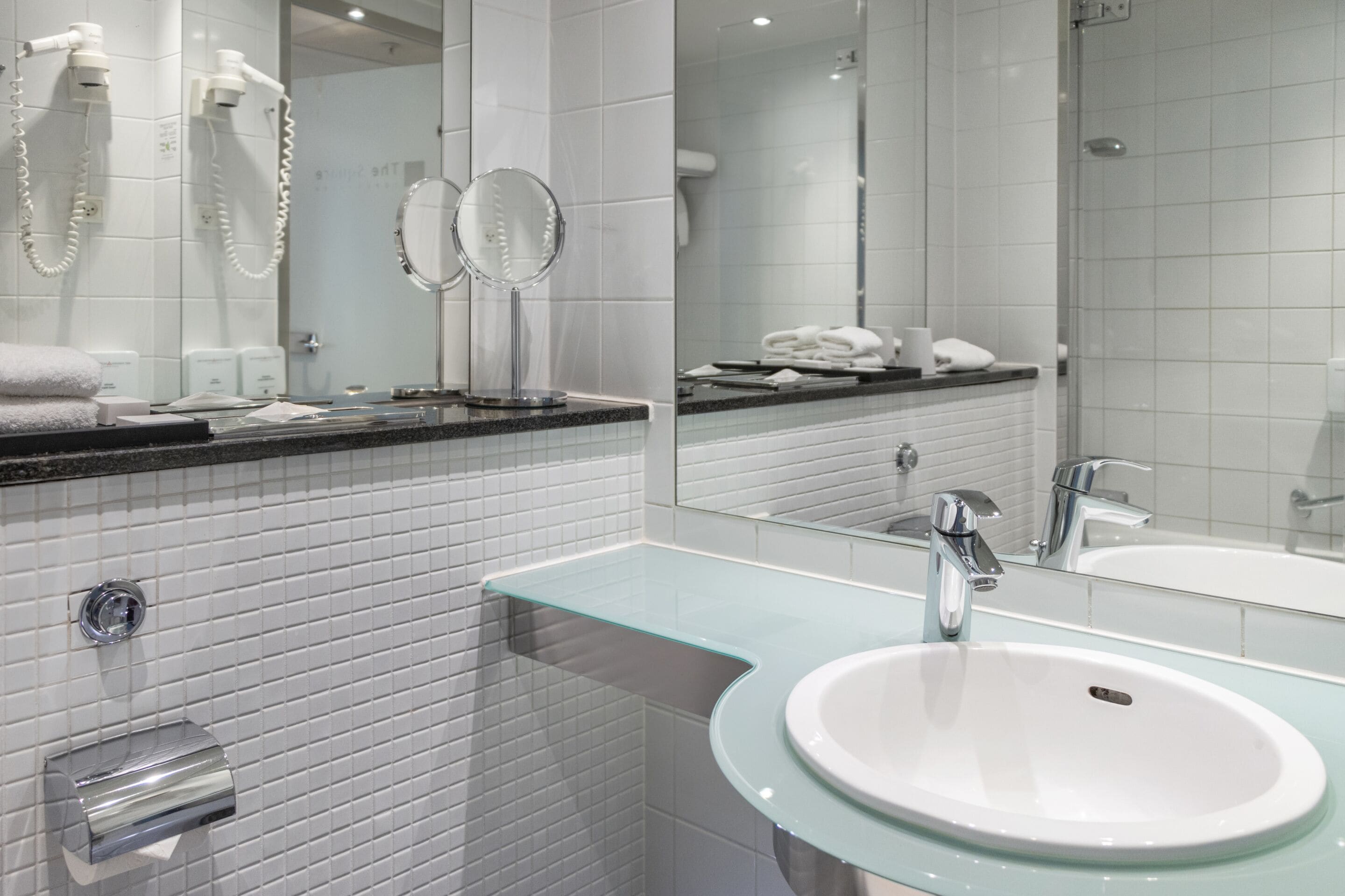 combined shower/bathtub, designer toiletries, hair dryer, towels