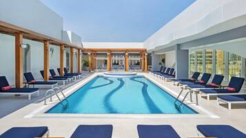 Outdoor pool, open 7:00 AM to 10:00 PM, free pool cabanas